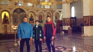 Геворг Кюрегян, Дмитрий и Михаил Захарьевы в сопровождении своего тренера…